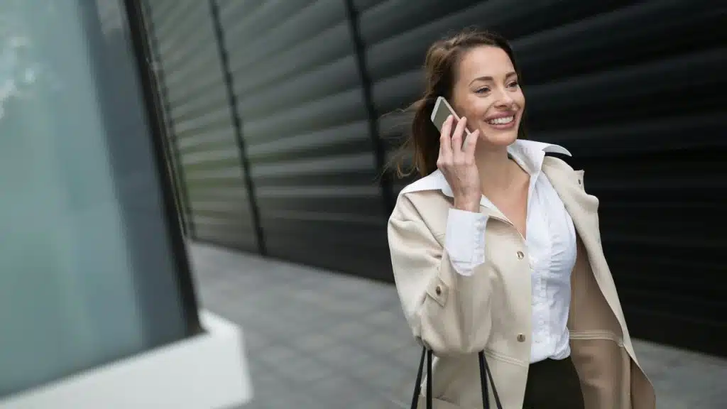 A businesswoman on the phone while walking
