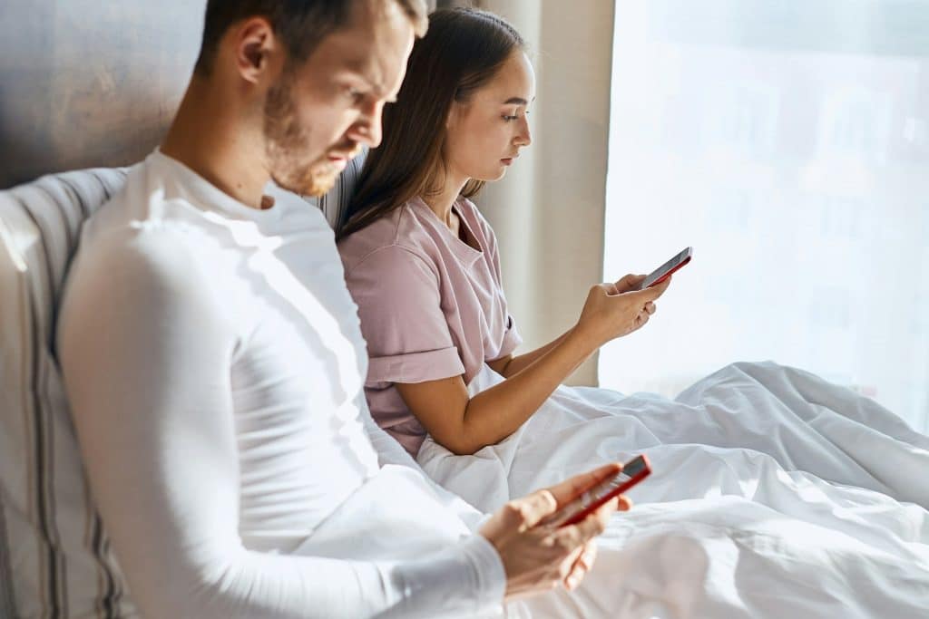 couple focused phone