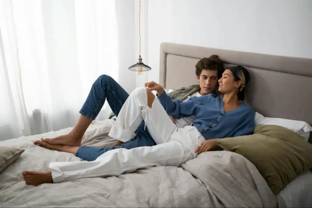 Couple lying at the bed