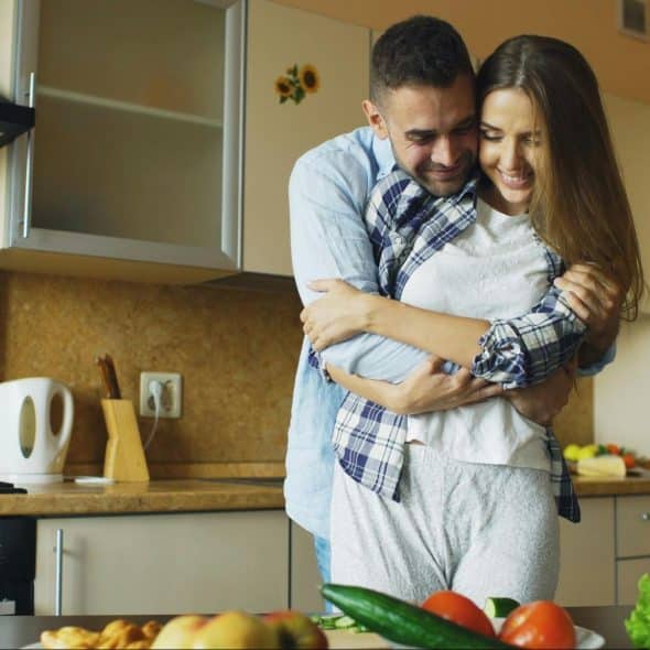 A man hugging a woman