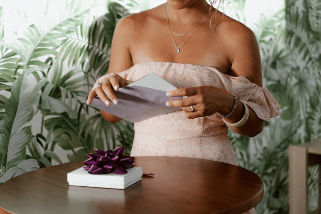 A woman opening an envelope