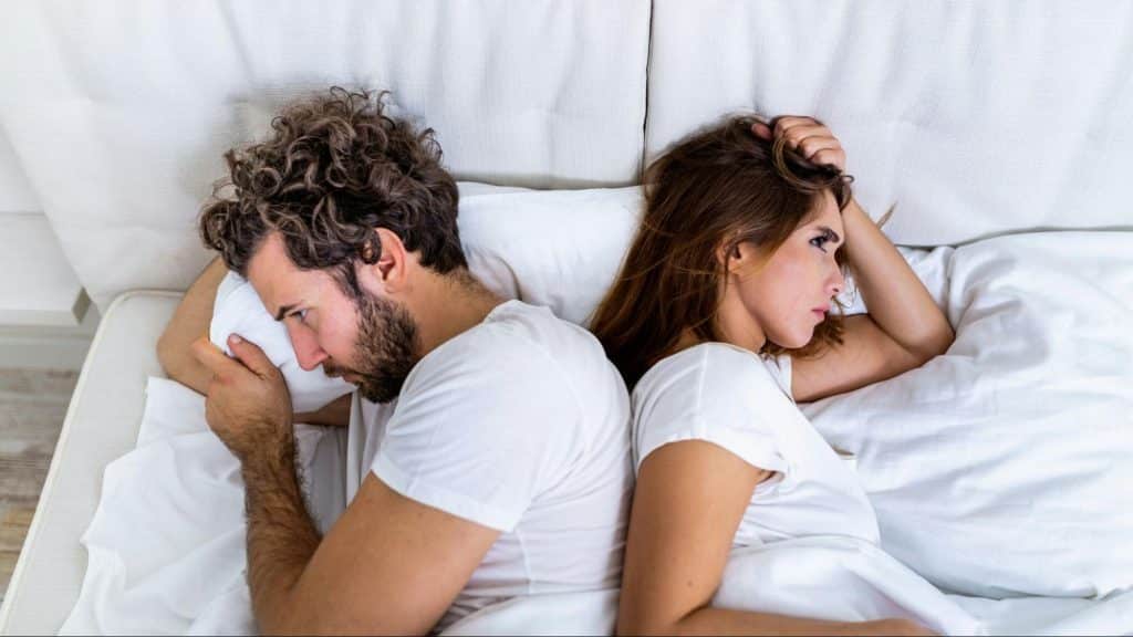 A man and woman ignoring each other