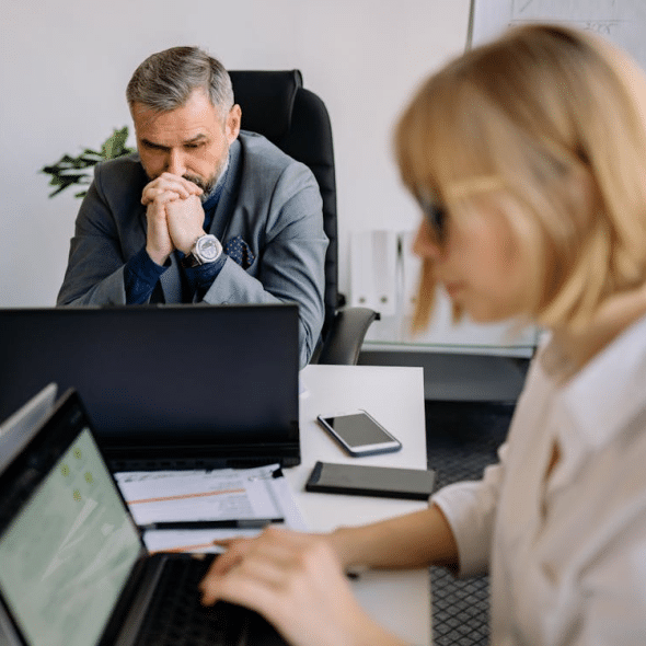 A man and a woman in an office