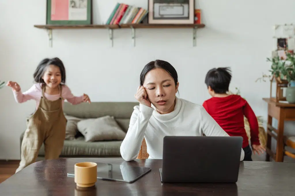 Kids making noise and disturbing stressed woman at home