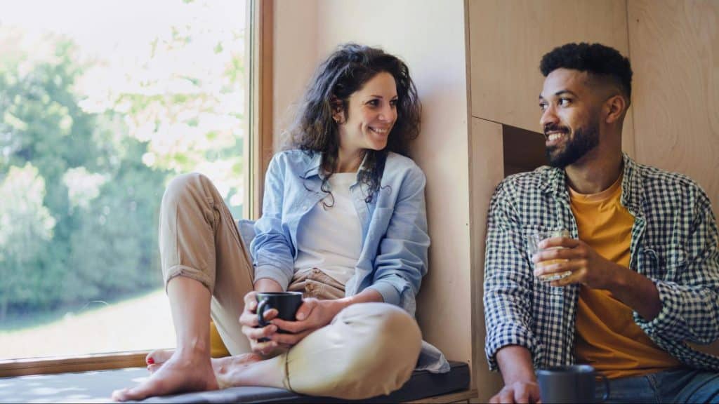 A man and woman smiling at each other