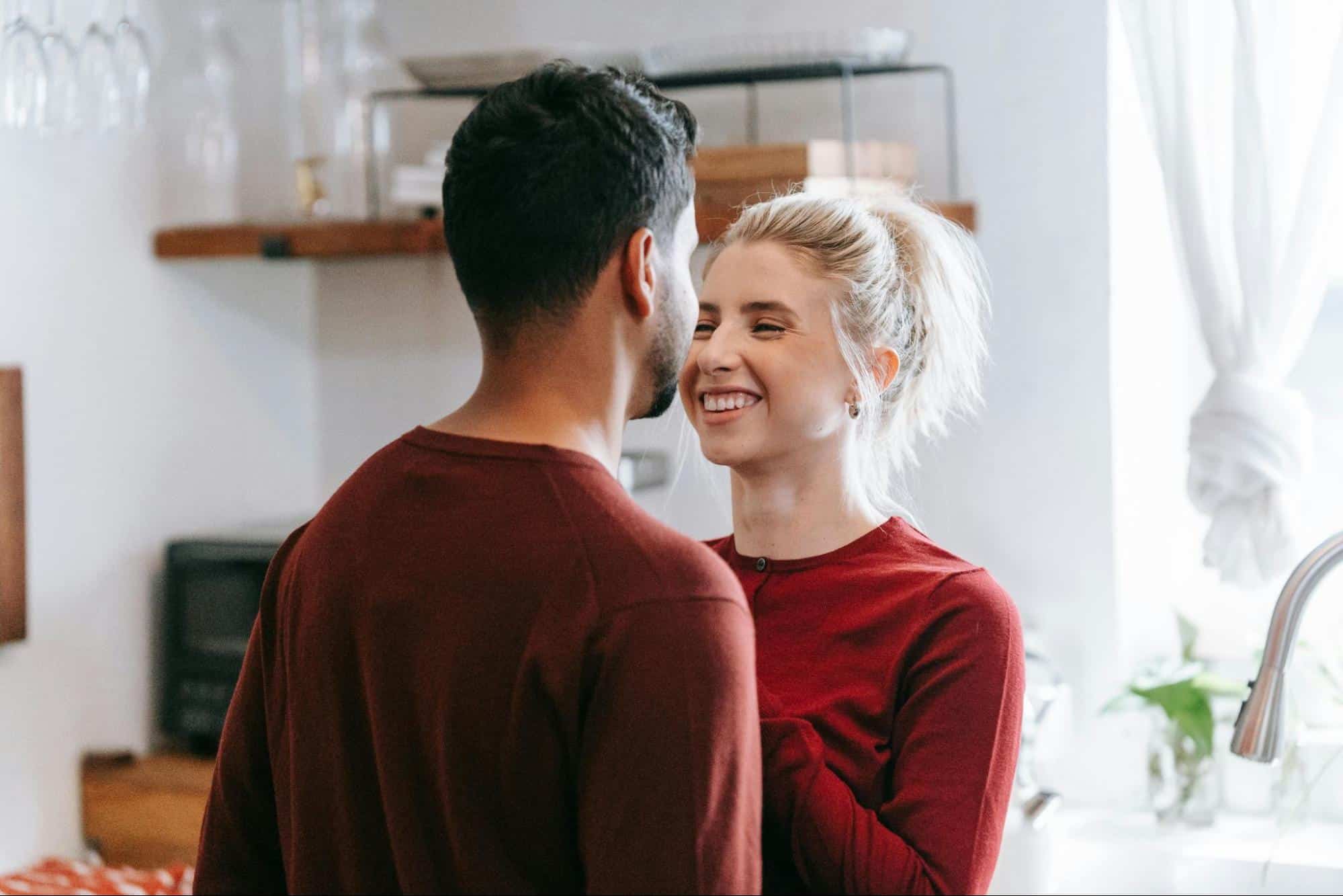 A man and a woman facing each other
