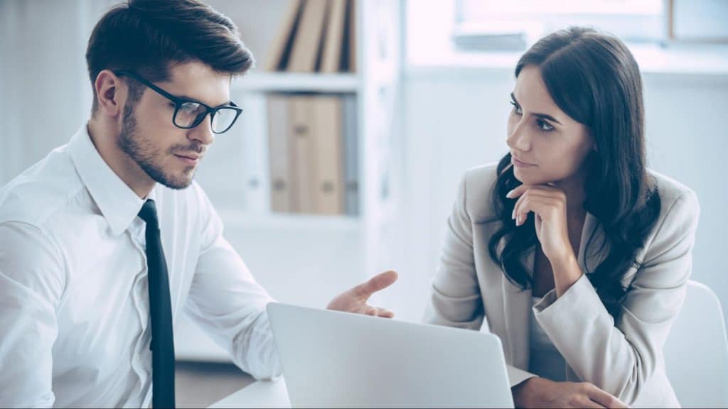 A man explaining to woman