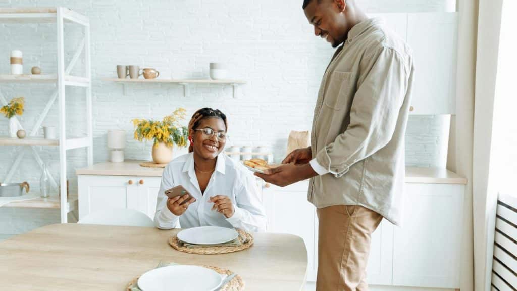 A smiling couple in a kitchen