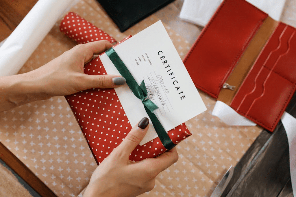 A woman holding a gift voucher