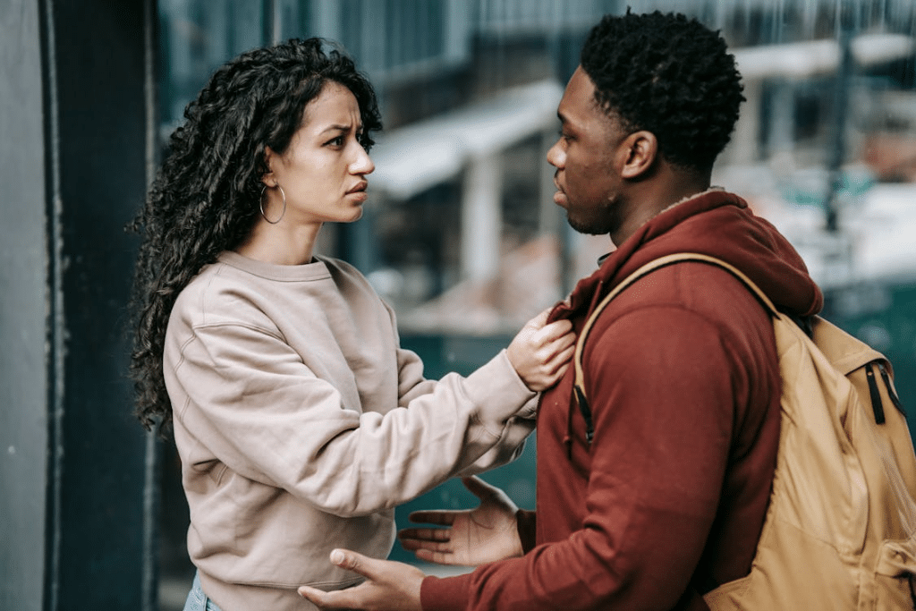 Young couple talking on street