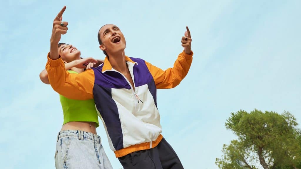 A joyful man and woman standing next to each other.