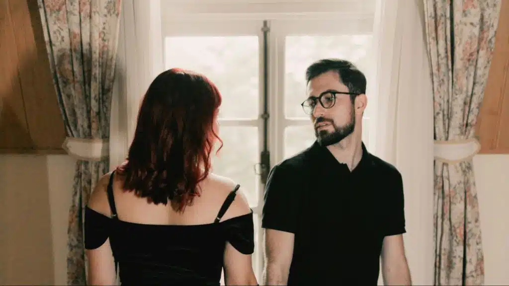 A man and woman looking at each other