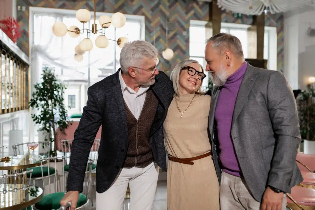 A Woman with Her Arms Around Two Males
