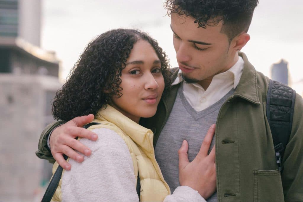 A man hugging a woman