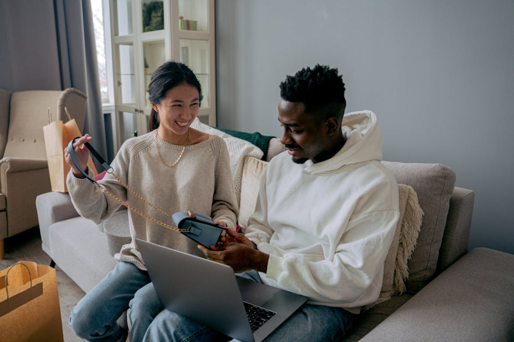 Couple on a couch, bonding and smiling
