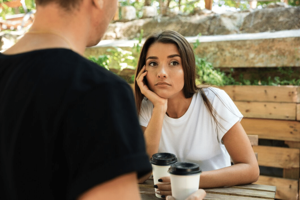 Young bored woman sitting