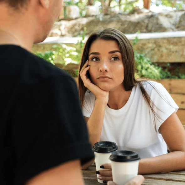Young bored woman sitting