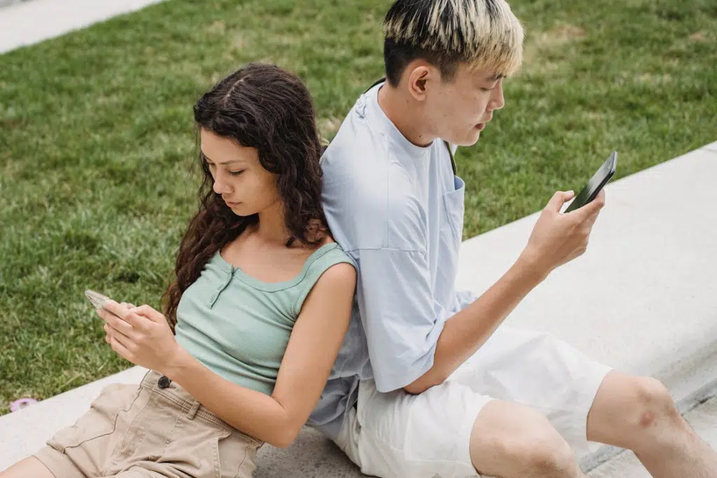 Couple browsing internet on smartphones