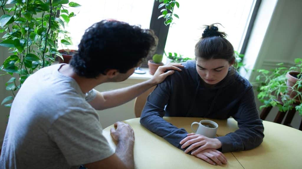 A couple looking sad while talking