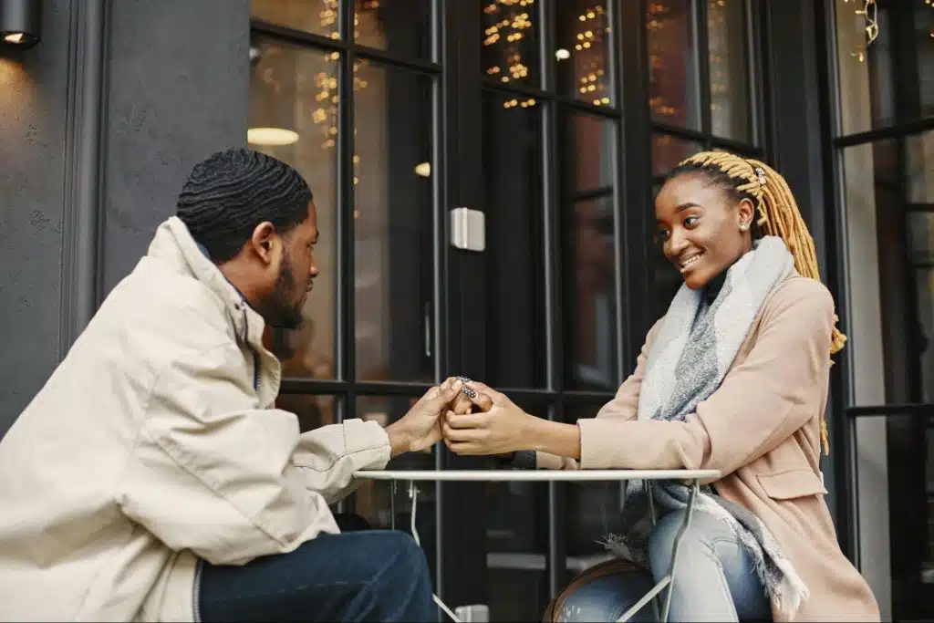 A man and woman holding hands