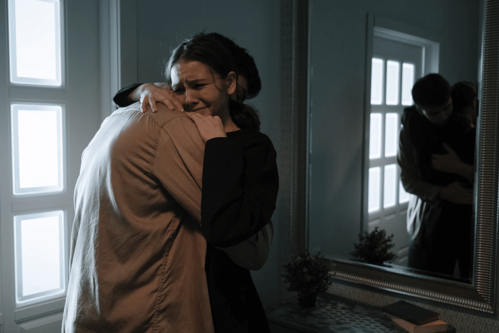 Emotional Woman Crying while Hugging