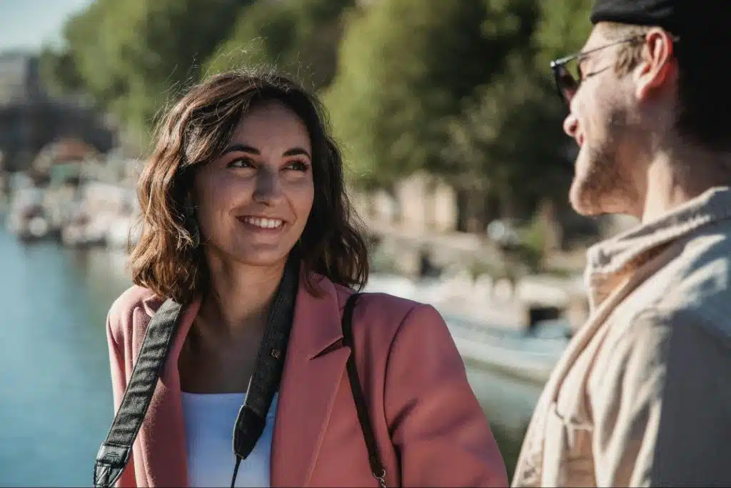 A woman smiling to a man
