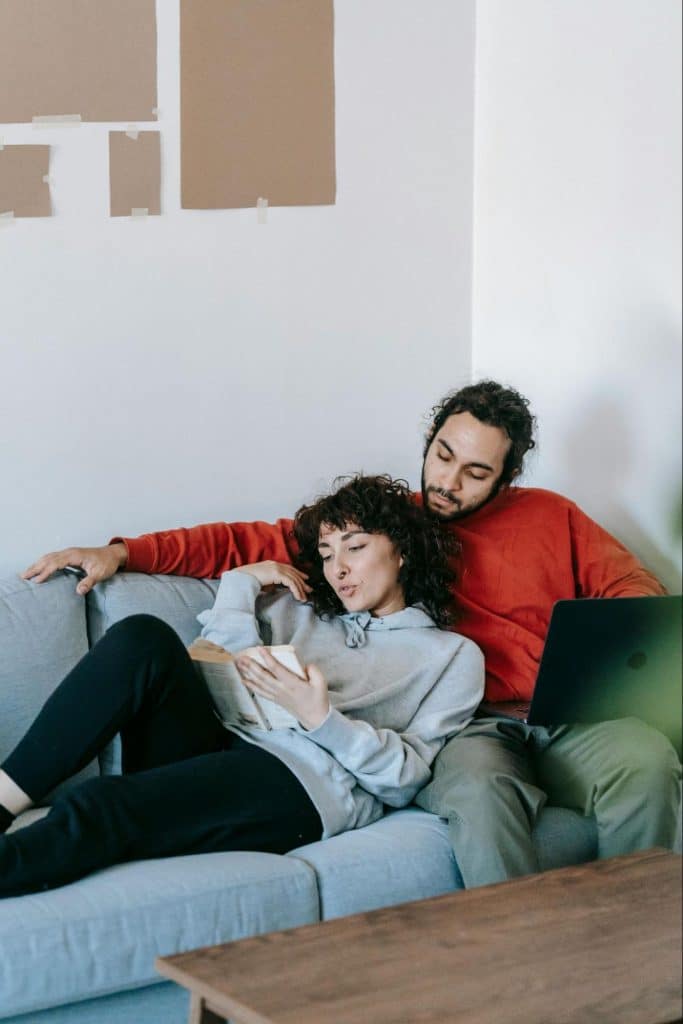 A man and woman at the couch