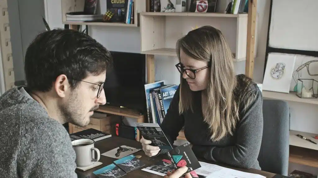A man and a woman sitting at a table.