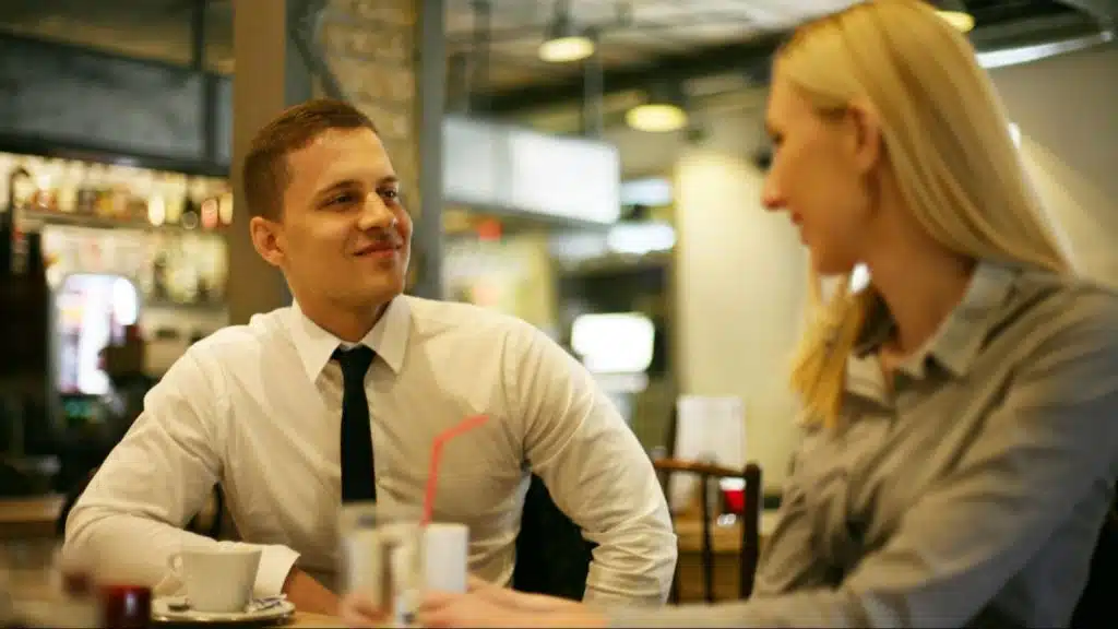 A man listening to a woman