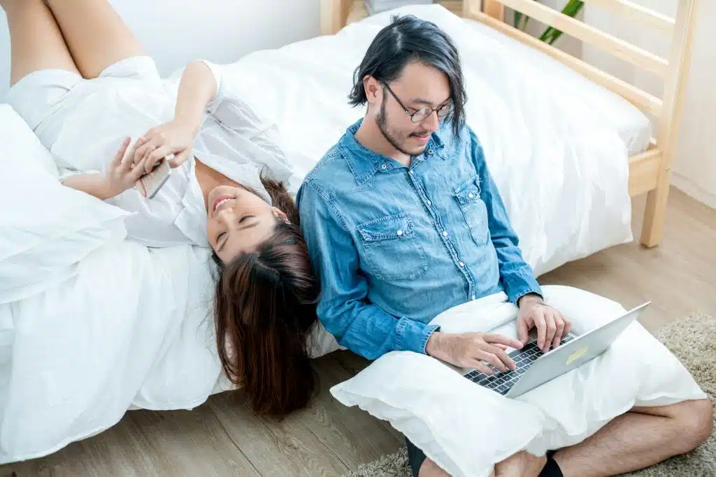 person multitasking while with a partner