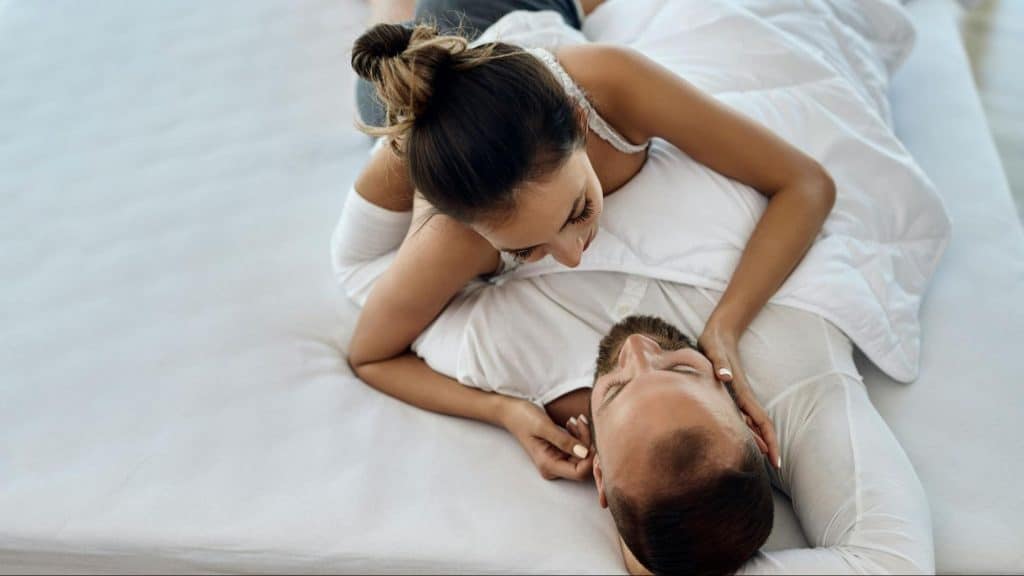 Woman holding a man’s face