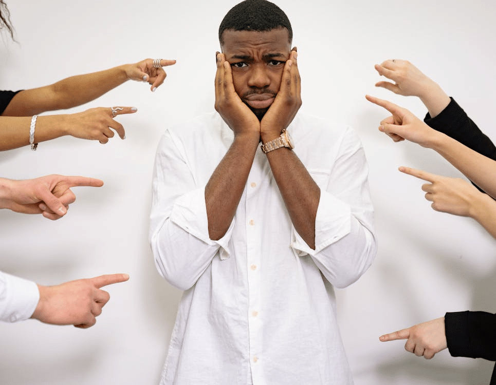 A Man Holding his Face