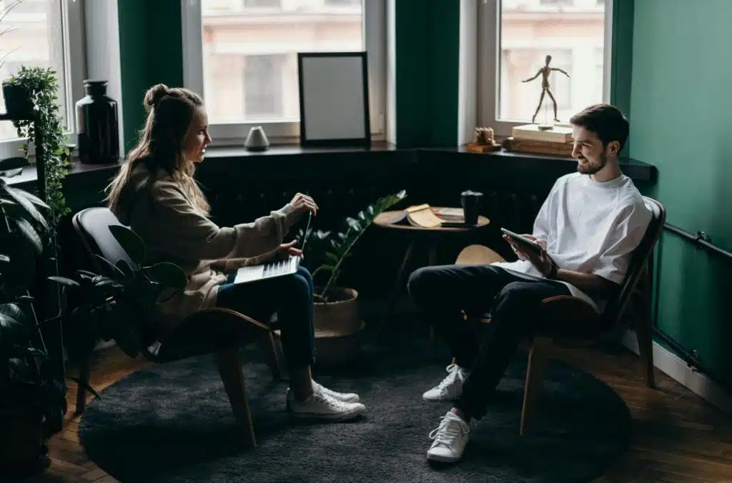 A woman making a first move to talk to a man after conflict