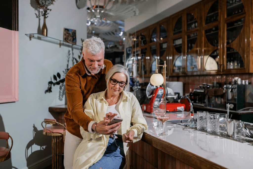 Elderly Couple using Phone