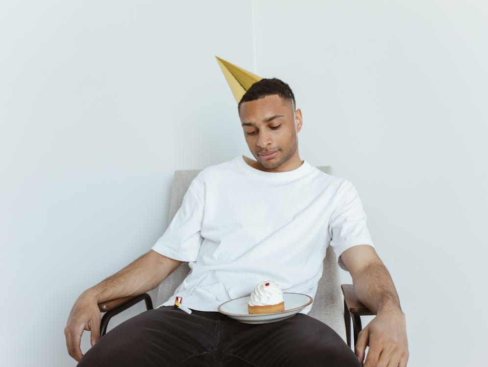 Man sitting down in chair lonely