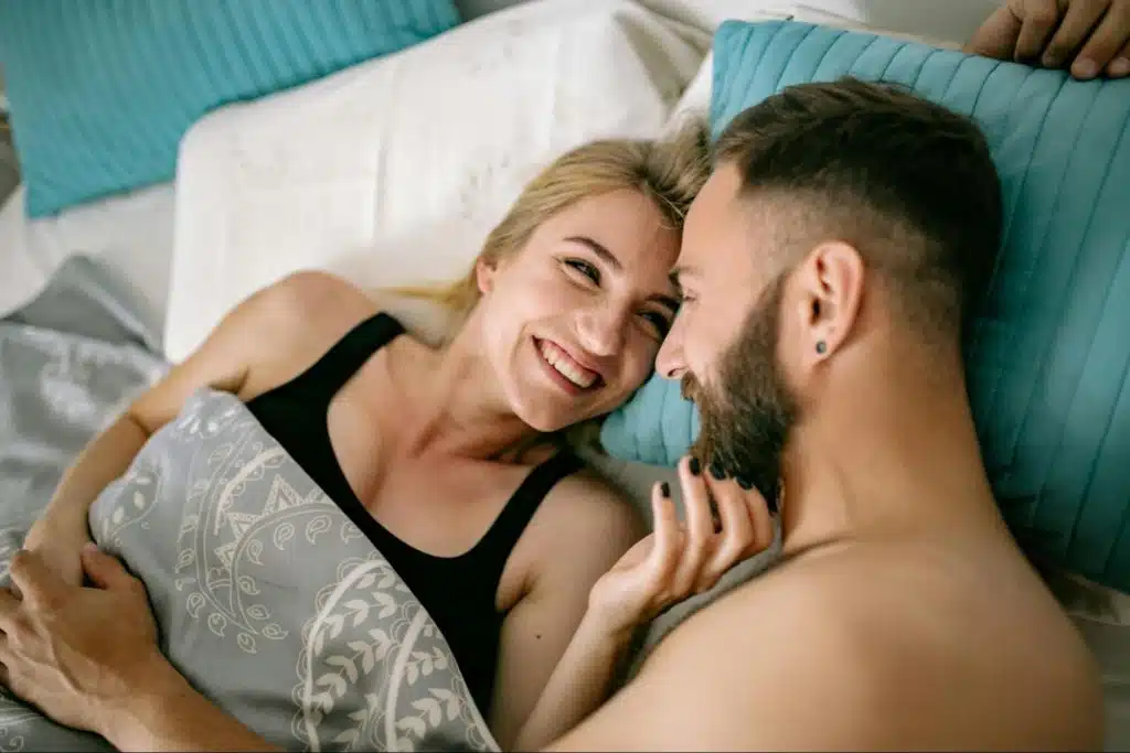 A man and woman smiling at each other
