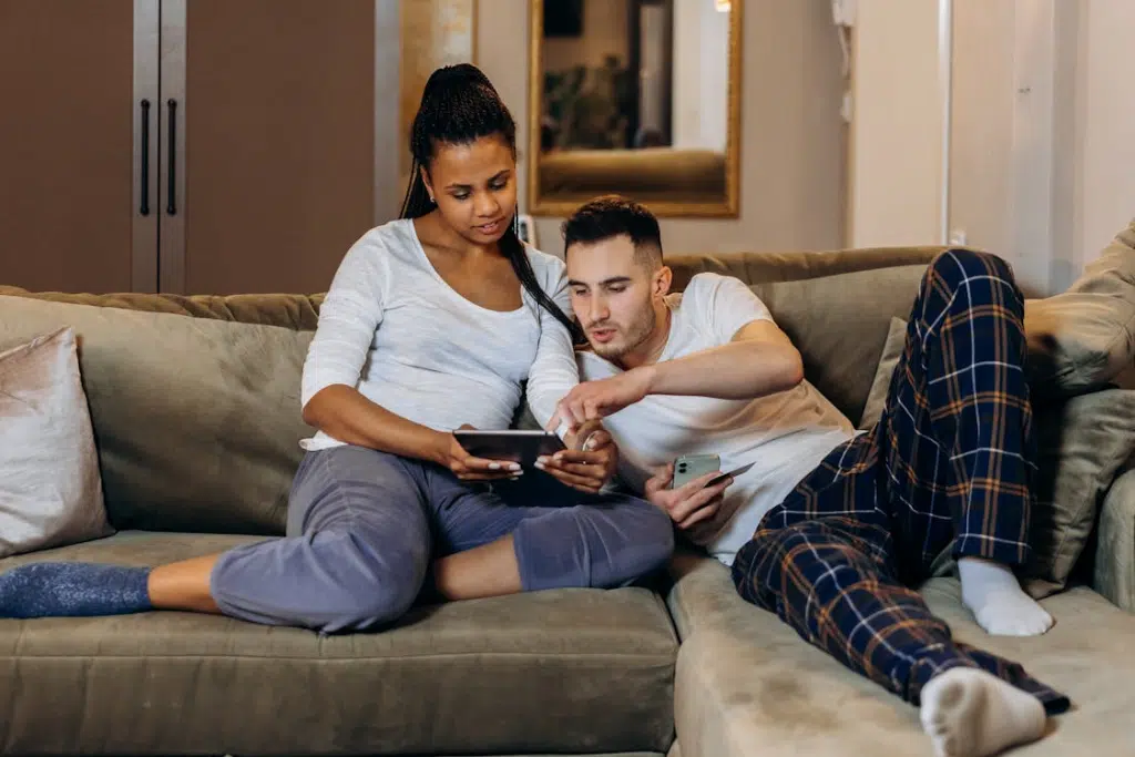 A Couple Using Electronic Gadgets