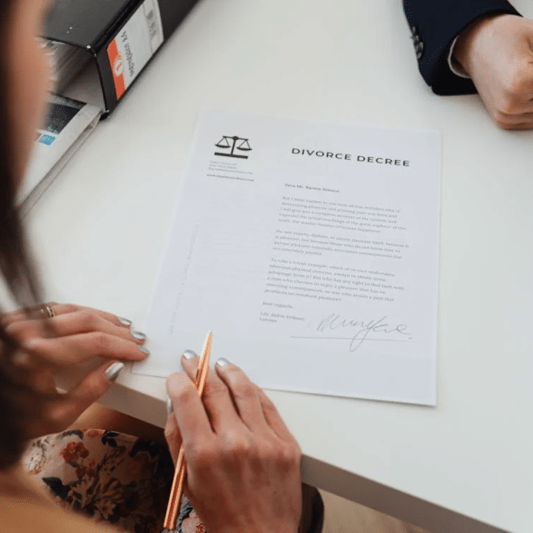 A Woman Reading a Divorce Decree Paper