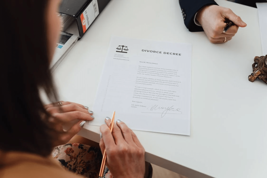 A Woman Reading a Divorce Decree Paper