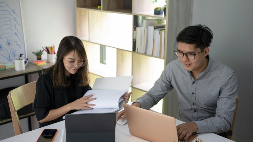 Man and woman working late together