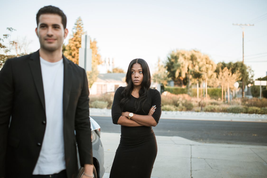 Upset woman looking coldly at man