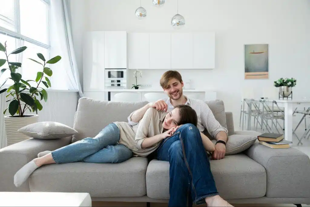 Woman lying on a man’s leg
