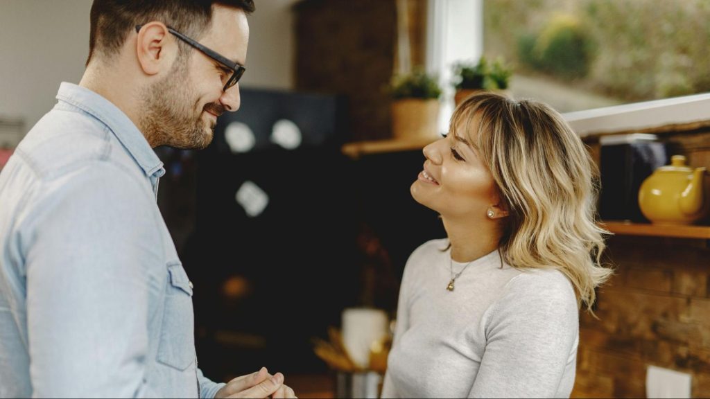 A man and woman talking