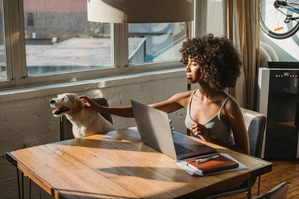 A man at home and using a laptop
