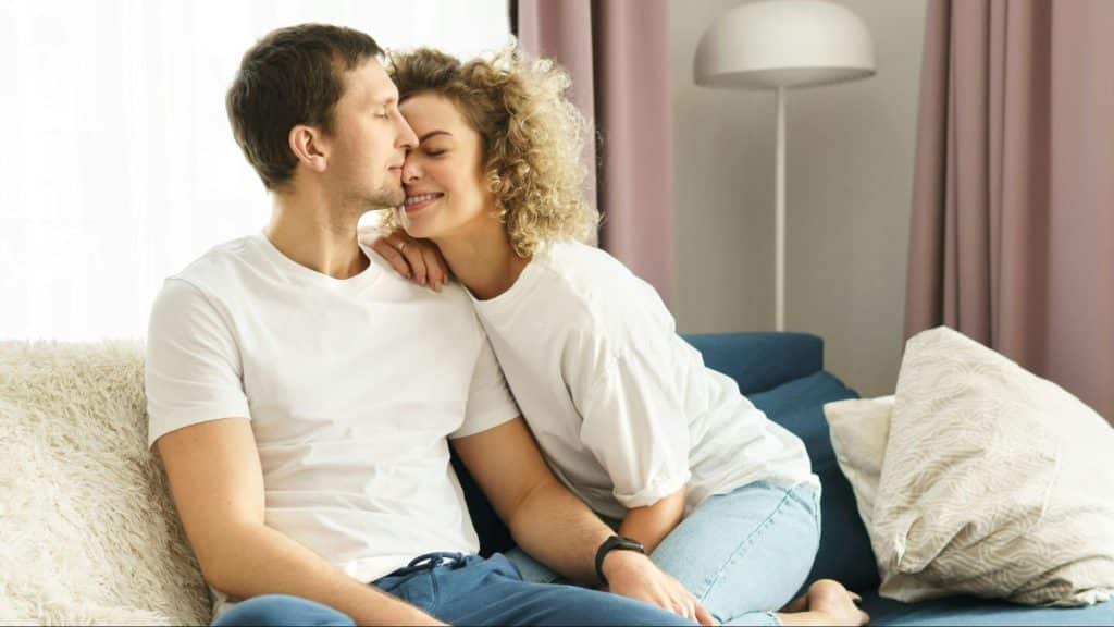 A man and woman at the couch