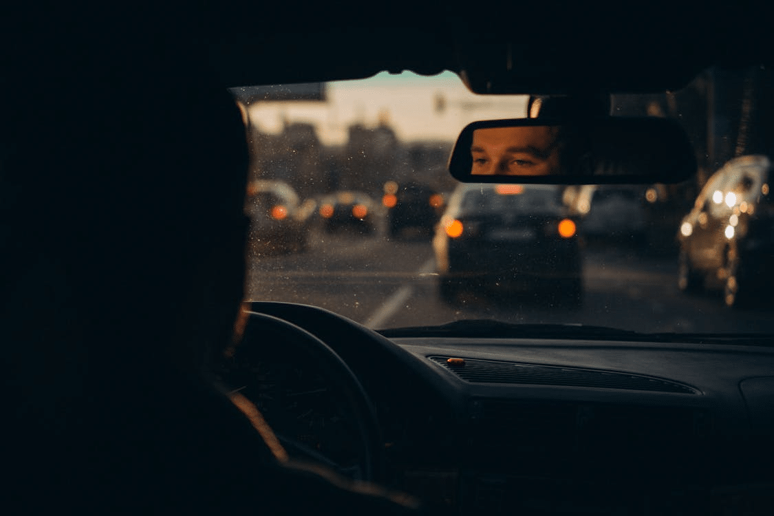 A man driving a car