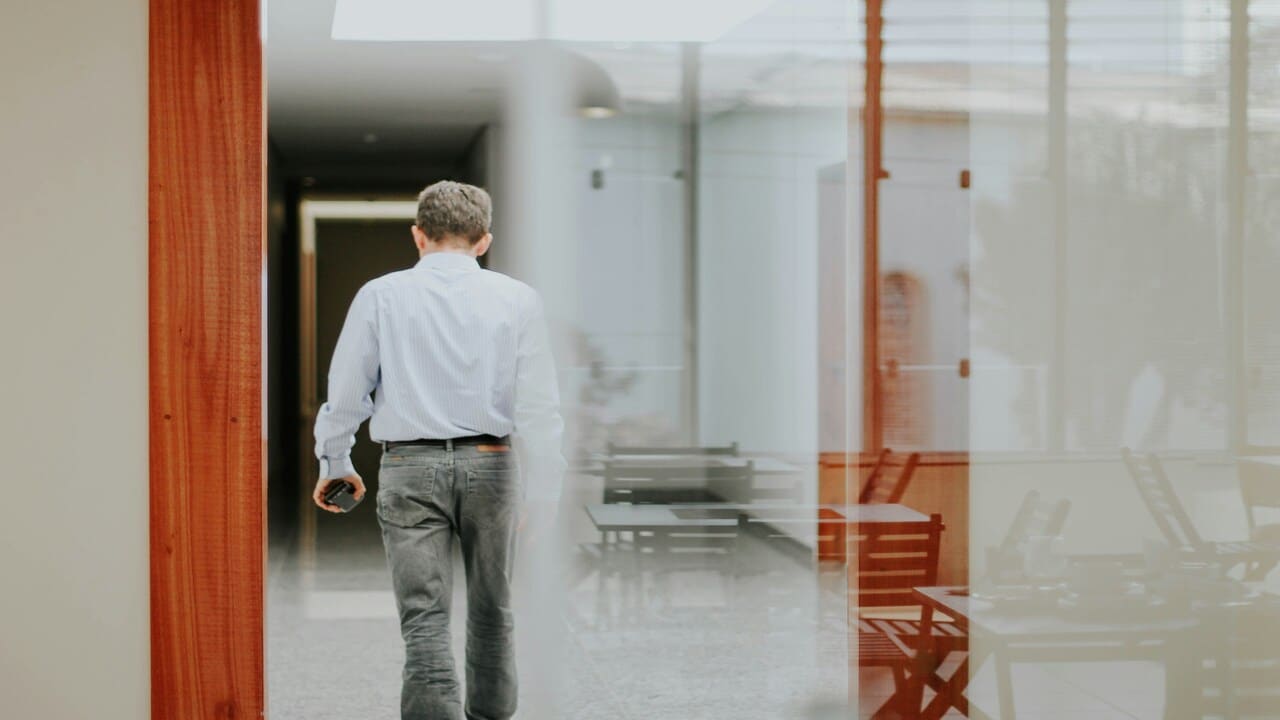 A man walking in the office