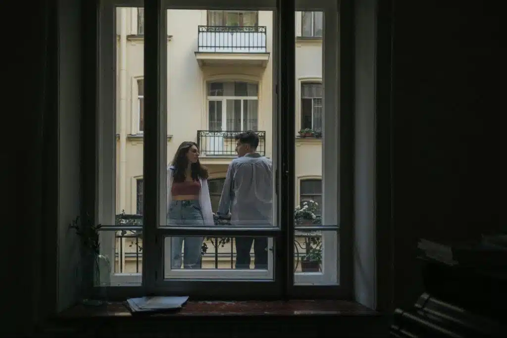 A man and woman at the balcony