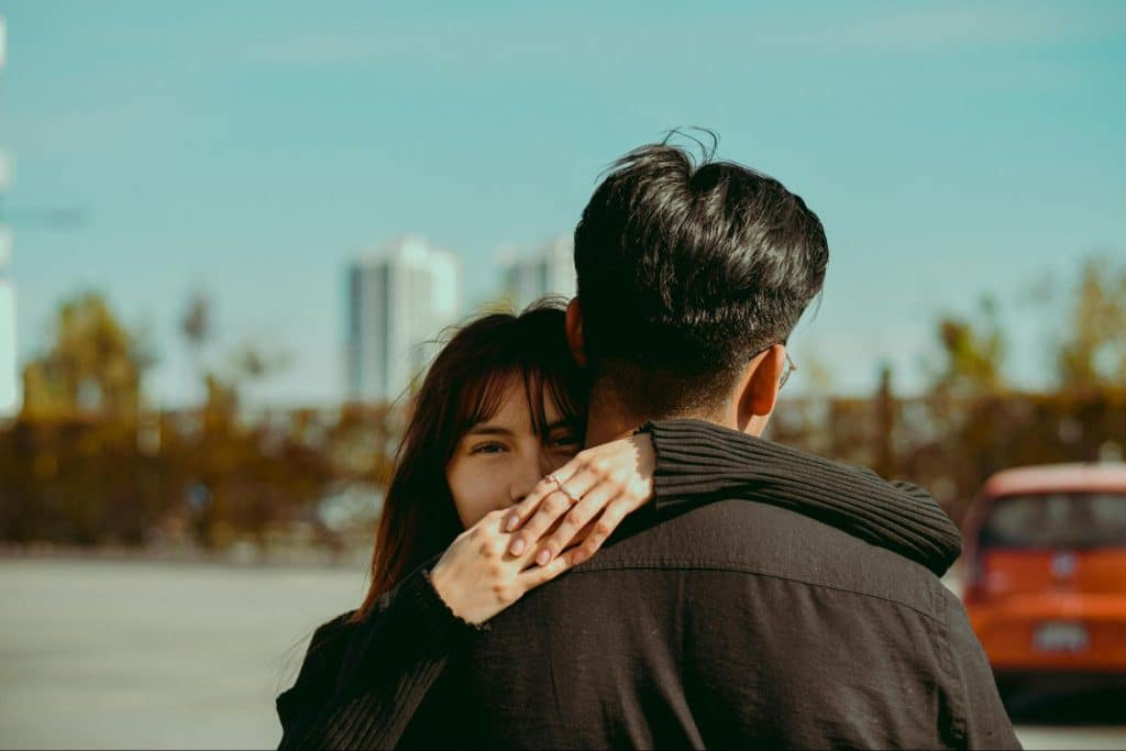Woman hugging a man