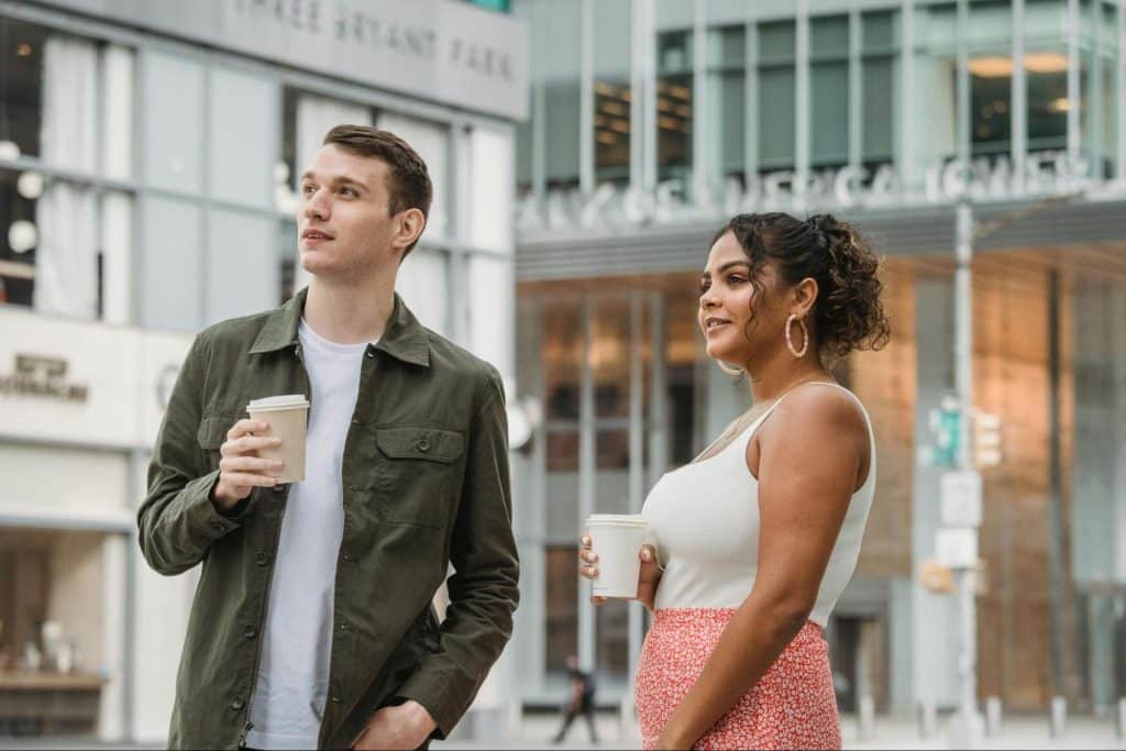 a man looking away from a woman